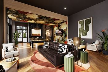 A living room with a brown couch and a floral print on the wall.